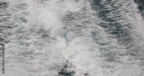 Ship wake up in the ocean. aves from the back of a speed boat over the water's surface in the sea. Waves behind a boat on a clear blue sea