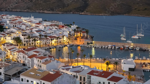 Sunset vivid colors and lights of Fornells town in Menorca, Spain