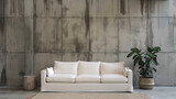 The room exudes an air of understated elegance, with a pristine white sofa anchoring the space against the industrial chic backdrop of a concrete paneling wall.