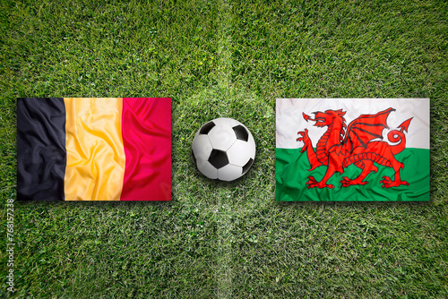 Fototapeta Naklejka Na Ścianę i Meble -  Belgium vs. Wales flags on soccer field