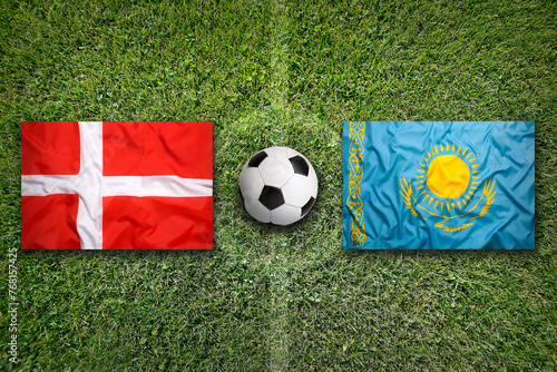 Denmark vs. Kazakhstan flags on soccer field