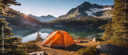 Camping with orange tent open with lake and mountains, Tourist tent in forest camp with cloudy sky