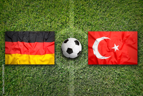 Germany vs. Turkey flags on soccer field