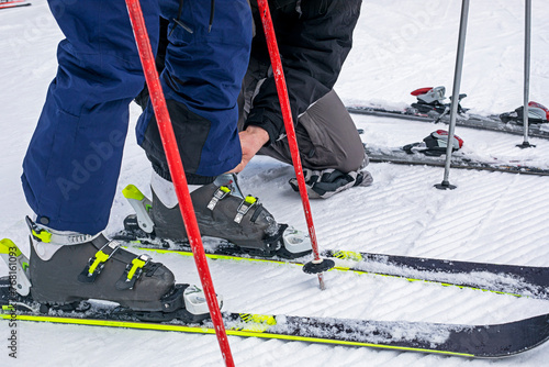 help fasten your boots on a soft slope. family active recreation