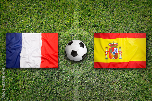 France vs. Spain flags on soccer field
