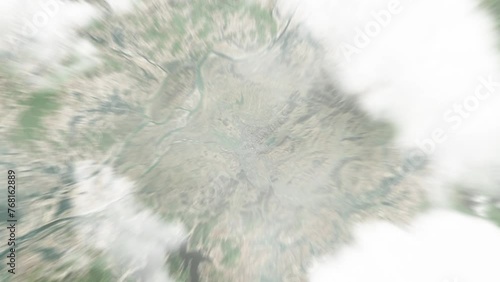 Earth zoom in from space to Kaech'on, North Korea. Followed by zoom out through clouds and atmosphere into space. Satellite view. Travel intro. Images from NASA photo