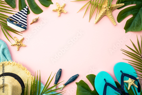 Summer flat lay background. Palm leaves, sea shells and accessories on pink.