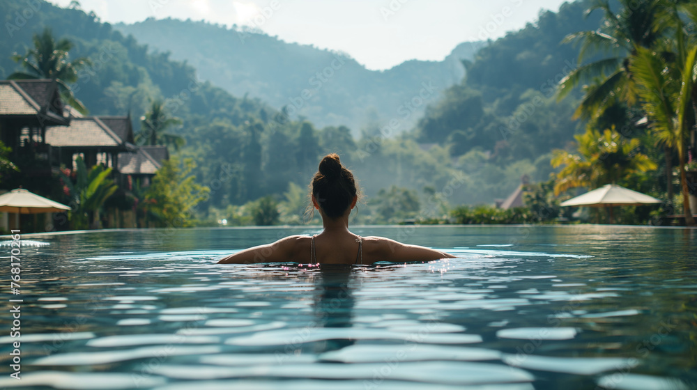 Surrounded by towering peaks cloaked in verdant forests, she moves with effortless grace through the pristine water. Surrounded by towering peaks cloaked in verdant forests, she moves with effortless grace through the pristine water.
