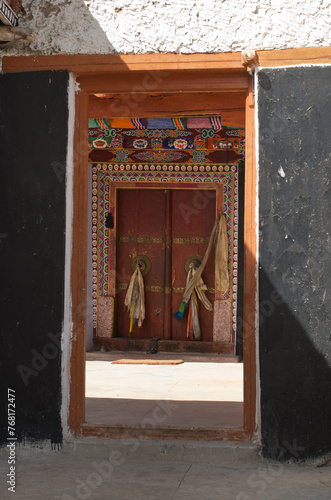 Colorfully decorated entrance and a closed door of a monastery  Ladakh  India.