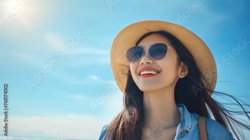 young asian tourist woman happy wearing beach hat sunglasses and backpacks going to travel on holidays blue background