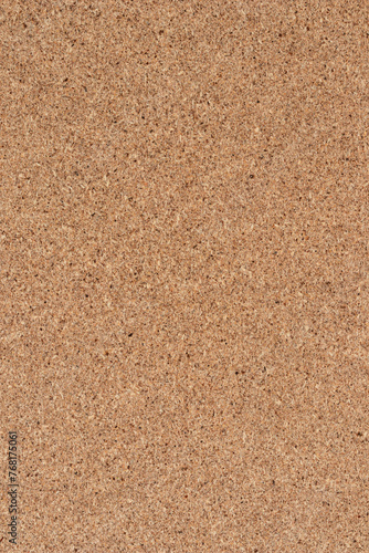 Brown textured cork board background. Textured wooden background. Vertical cork board with copy space.