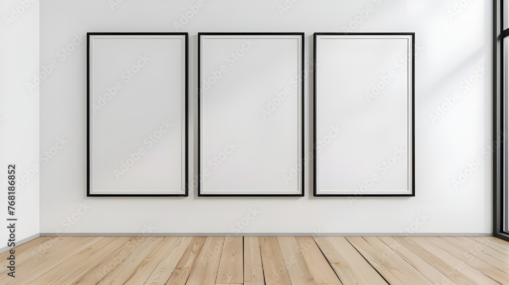 Three empty vertical black frame mock up in a white interior room ...
