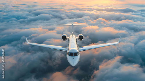 A private jet flies high above the clouds. The sun is rising, casting a pink and purple glow on the clouds.