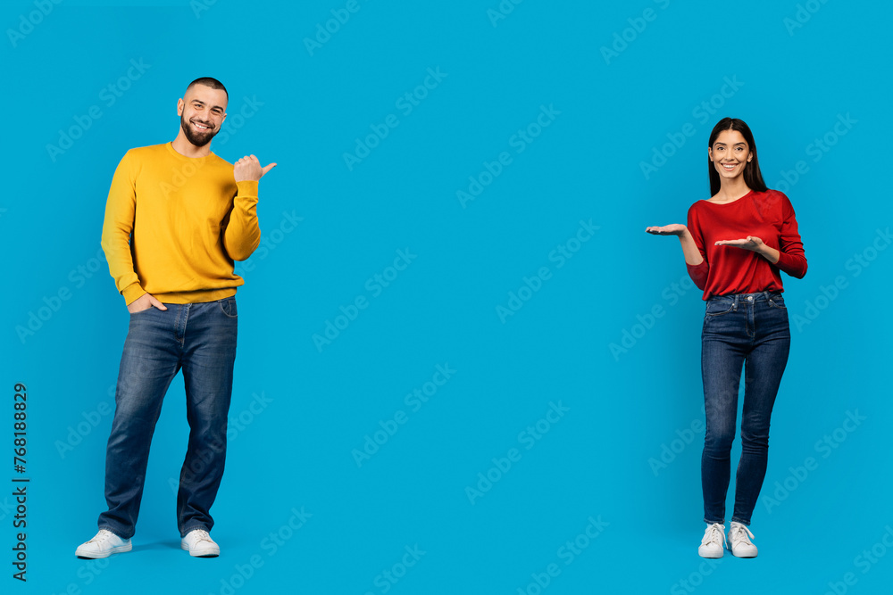 Happy European Couple Pointing At The Middle Of Copy Space Happy European Couple Pointing At The Middle Of Copy Space
