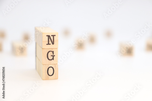 Acronym NGO (Non-Governmental Organization) isolated on white background. concept of health, sustainable development, education. photo