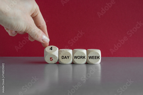 4 or 5 day work week symbol. Turned cubes and changes words 5 day work week to 4 day work week. Beautiful red background. Business and 4 or 5 day work week concept.