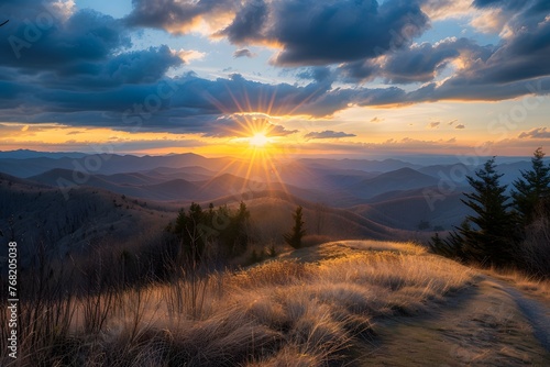 The sun is setting over a mountain range