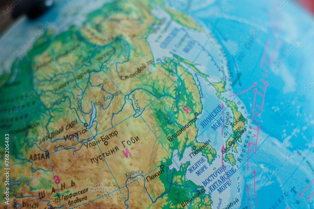 Globe with a large stick. Countries and cities on the globe. geography Globe with a large stick. Countries and cities on the globe. geography