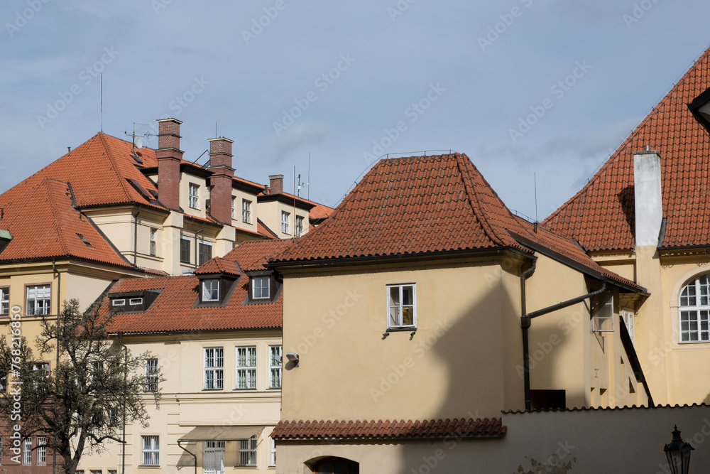 Typical European architecture. Old houses in Prague with tiled roofs.