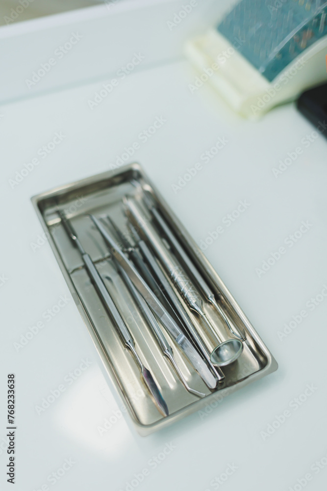 Sterile metal instruments for dental treatment. Tools for the dental office Sterile metal instruments for dental treatment. Tools for the dental office