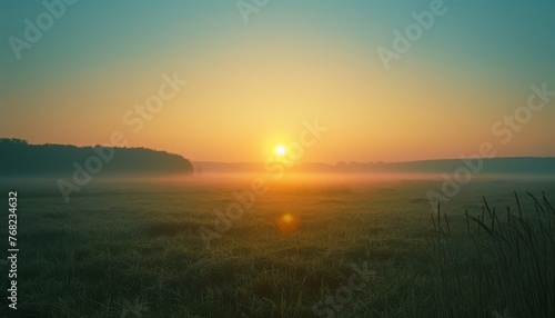 Sun Setting Over Foggy Field