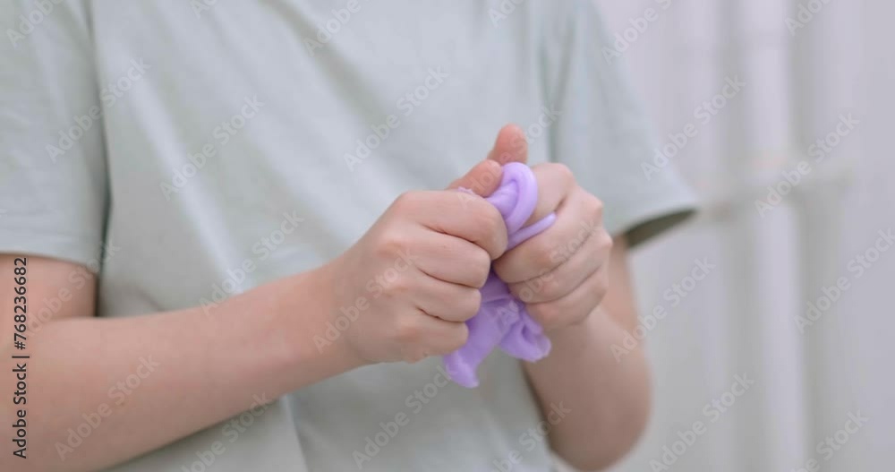 Child delightfully playing with homemade purple slime, stretches slime to the sides, an engaging sensory activity, concept for educational content, toy stores, and child development at home Child delightfully playing with homemade purple slime, stretches slime to the sides, an engaging sensory activity, concept for educational content, toy stores, and child development at home