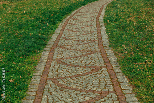 Brick way with grass on sides, Poland