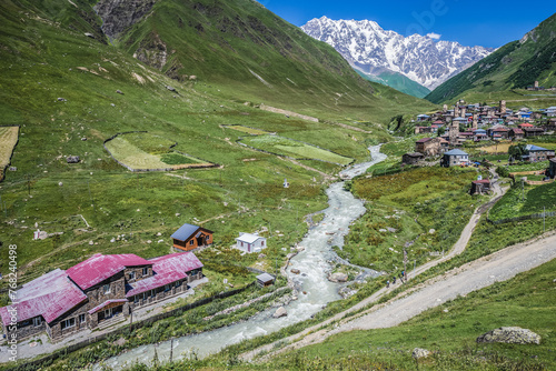 View of Mount Shkhara and buildings in Ushguli community villages in Svaneti region, Georgia photo