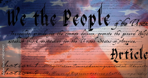 Digital image of a written constitution of the United States moving in the screen with a flag while 