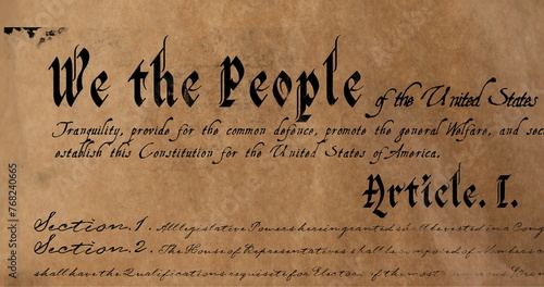 Digital image of a written constitution of the United States zooming in and out of the screen agains