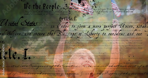 Digital composite of a Caucasian child holding out two American flags outdoors while a written const
