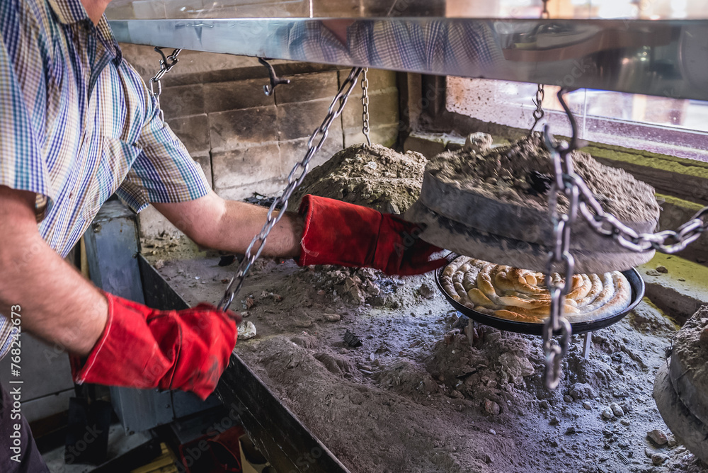 Baking of Bosnian rolled burek dish in Sarajevo, Bosnia and Herzegovina