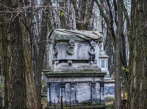 Old graves on Jewish Cemetery in Warsaw, Poland photo