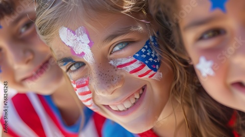 Close-up of cheerful kids with face painting of American flag. Patriotic holiday concept with copy space for design and print
