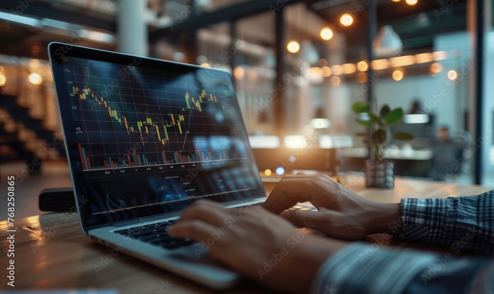 Businessman is watching a graph of the price of stocks displayed on a screen in an office Businessman is watching a graph of the price of stocks displayed on a screen in an office