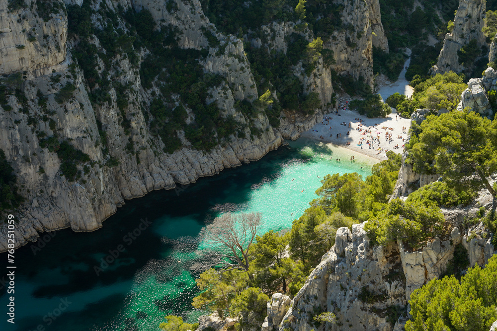 Calanque d'En-vau remote beach with turquoise water surrounded by cliffs, beautiful summer swimming and relaxing spot, aerial view, Calanques National Park, Provence, France