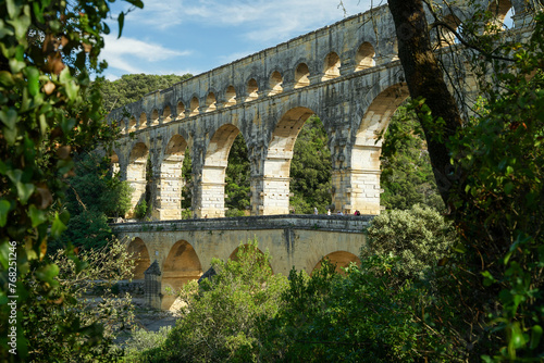 Pont du Gard famous aqueduct bridge with three arched tiers, built in first century by Romans, popular tourist landmark, France