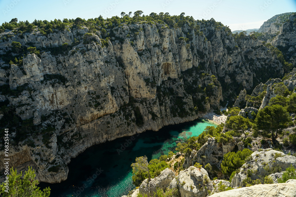 Calanque d'En-vau remote beach with turquoise water surrounded by cliffs, beautiful summer swimming and relaxing spot