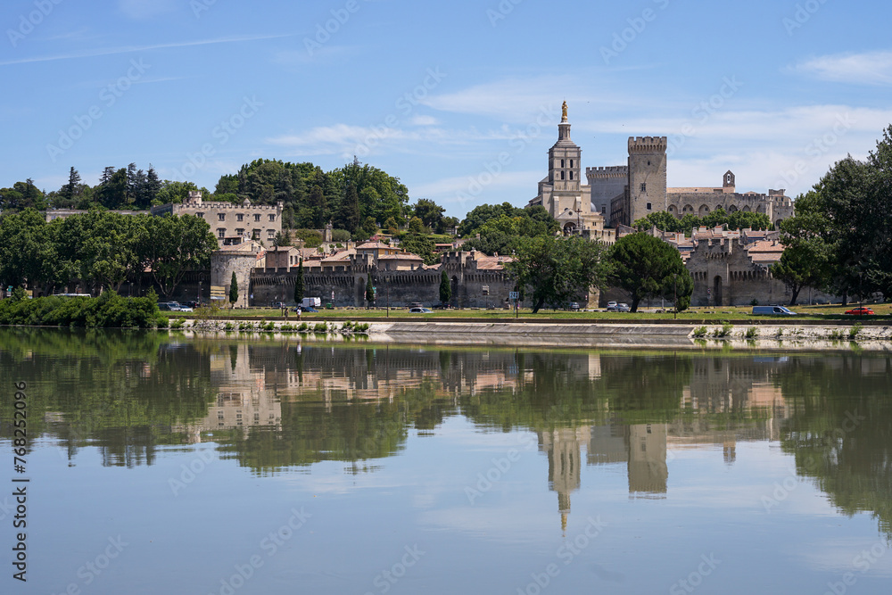 Avignon panoramic view mirroring in Rhone River, popular tourist landmark, Provence, France