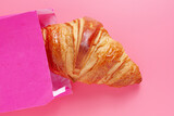 Croissant in a pink bag