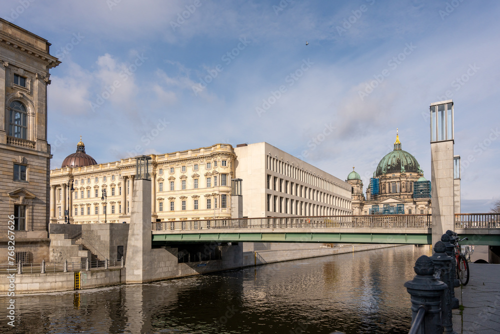 The river flows along the ancient houses of the European city of Berlin. Ancient houses and river in Berlin.