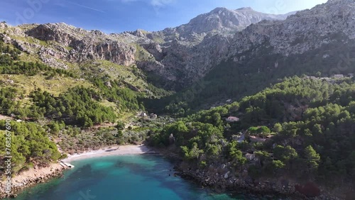 Mallorca, turquoise water in bay between mountains aerial drone footage of Cala Tuent photo