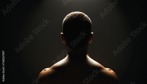 Human being or individuality or personality psychologic concept with abstract human body silhouette surrounded golden rays on black background. Vector illustration photo