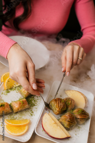 Künefe mit gebKünefe mit gebrannten Pistazien mit Mozzarella und Teerannten Pistazien mit Mozzarella und Tee photo