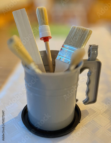 Set of hand brushes with container. photo