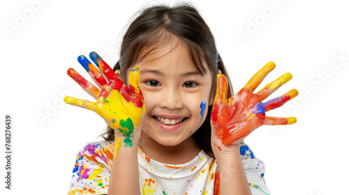Portrait of a child with hands dirty from paint