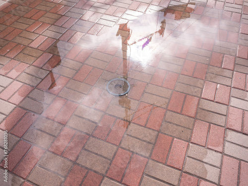 Wallpaper Mural pool on the brick pavement after rain in capital kyiv Torontodigital.ca