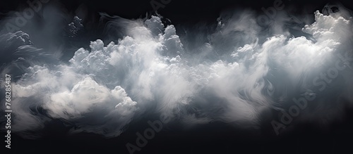 A billowing cloud of smoke illuminated in the darkness, creating an ominous and eerie atmosphere photo
