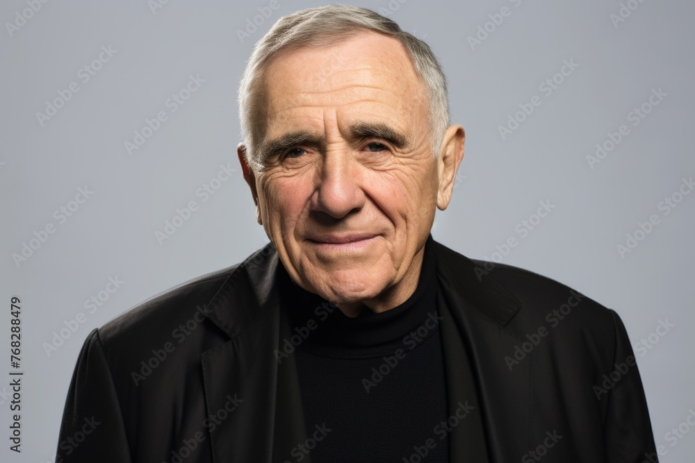 Portrait of a senior man. Isolated over grey background. Portrait of a senior man. Isolated over grey background.