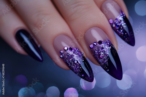 Royal purple French manicure with sparkling amethyst rhinestones against dark sapphire blue backdrop.